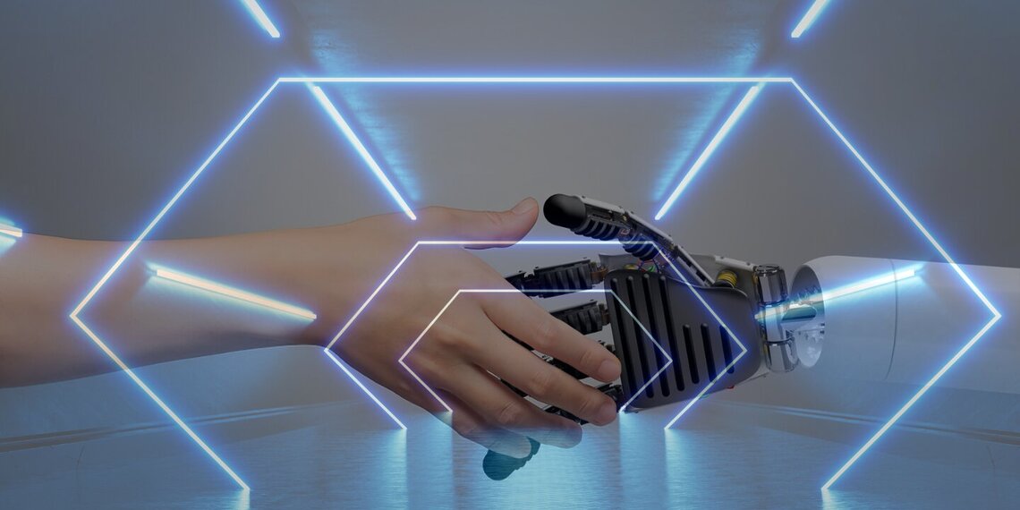An image of a human hand, shaking hands with a robotic hand.